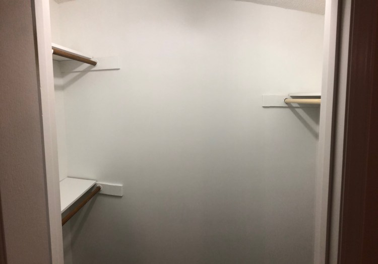 A walk-in closet in Bedroom 3