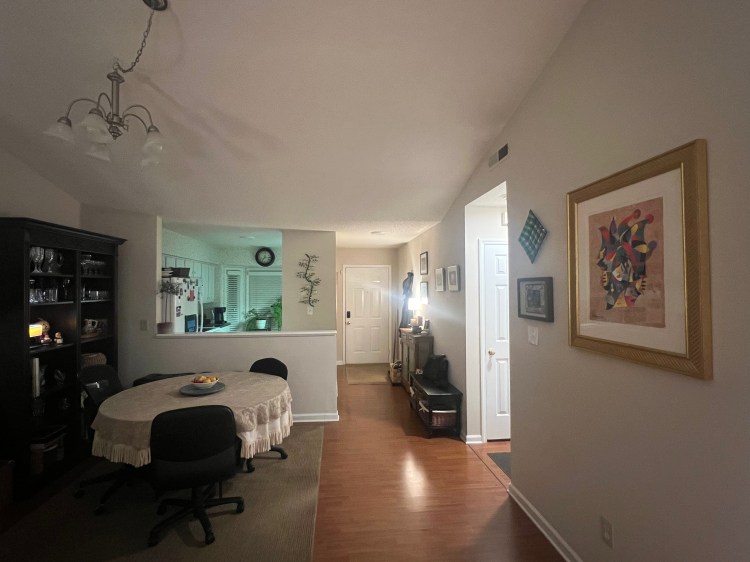 Dining room with kitchen and foyer.